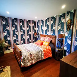 blue patterned wallpaper in bedroom
